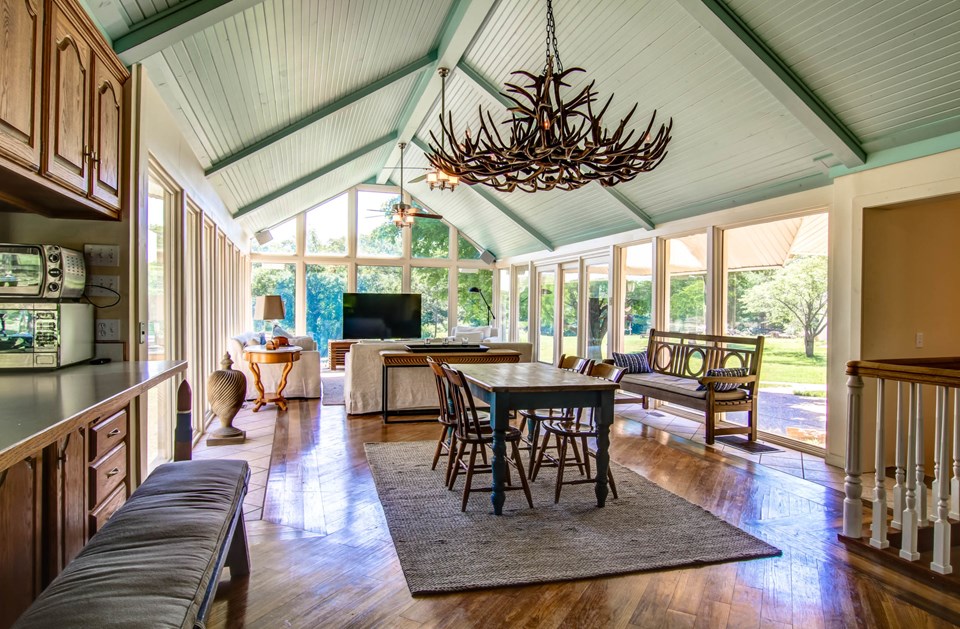 huge great room features sun room.