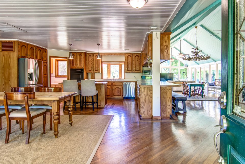 view upon entering. kitchen to the left. great room with sun room to the right.