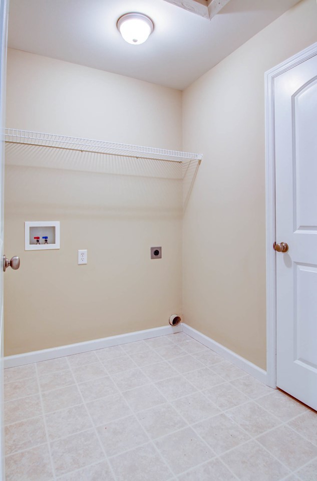 large laundry room with walk-in closet.