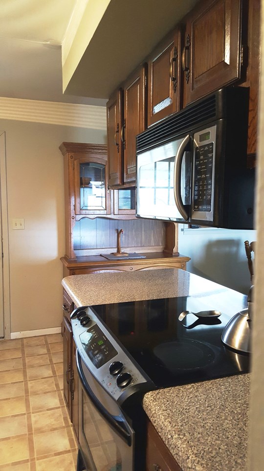 built-in microwave and smooth surface cooktop.