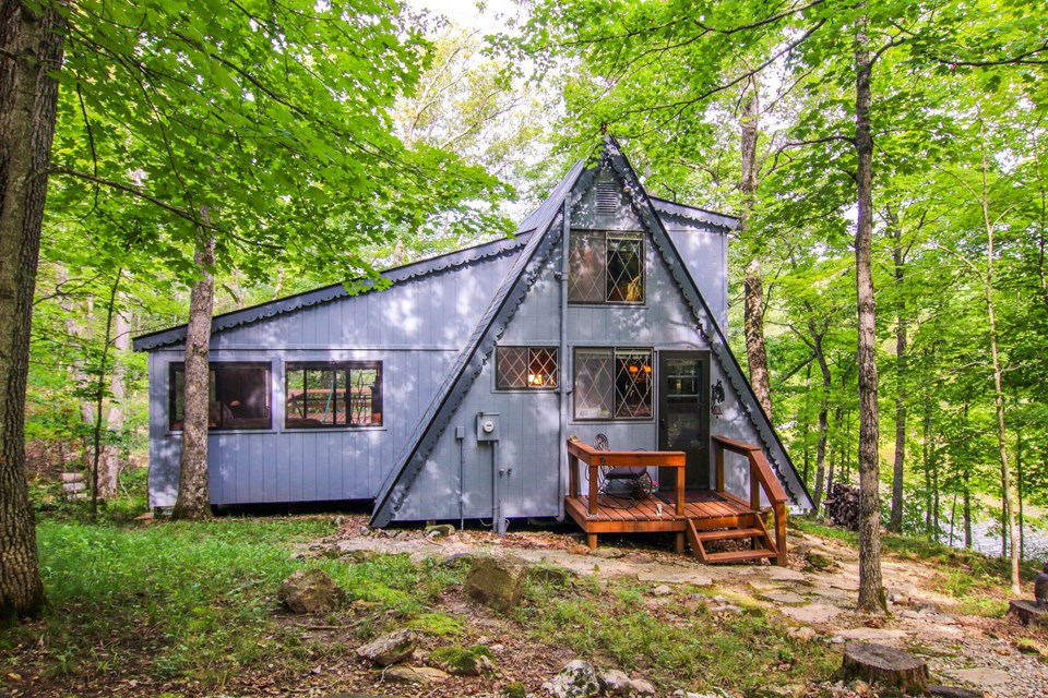 lovely chalet sits on the shores of lake innsbrook.