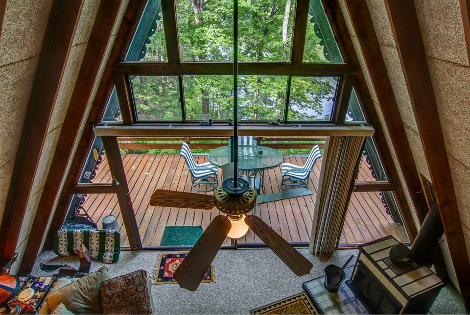 view of the wall of windows from the sleeping loft.