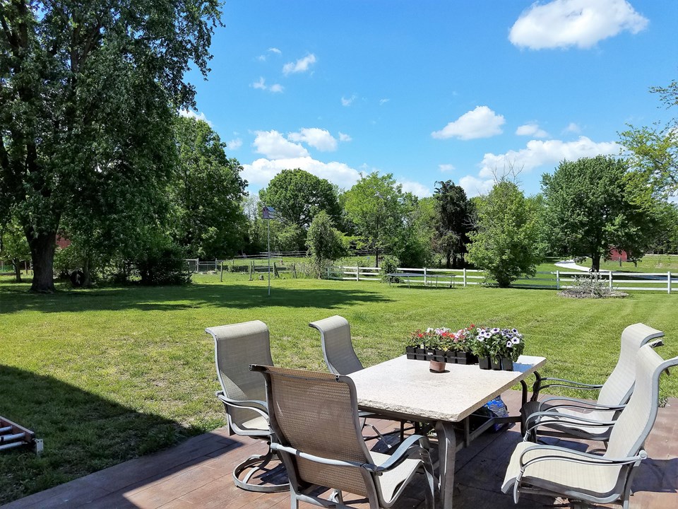deck overlooks the large yard.
