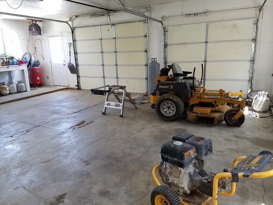 outbuilding is insulated with 2 overhead doors.